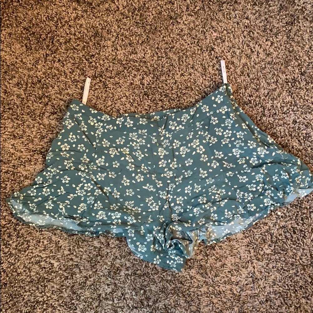 Frill, teal shorts
